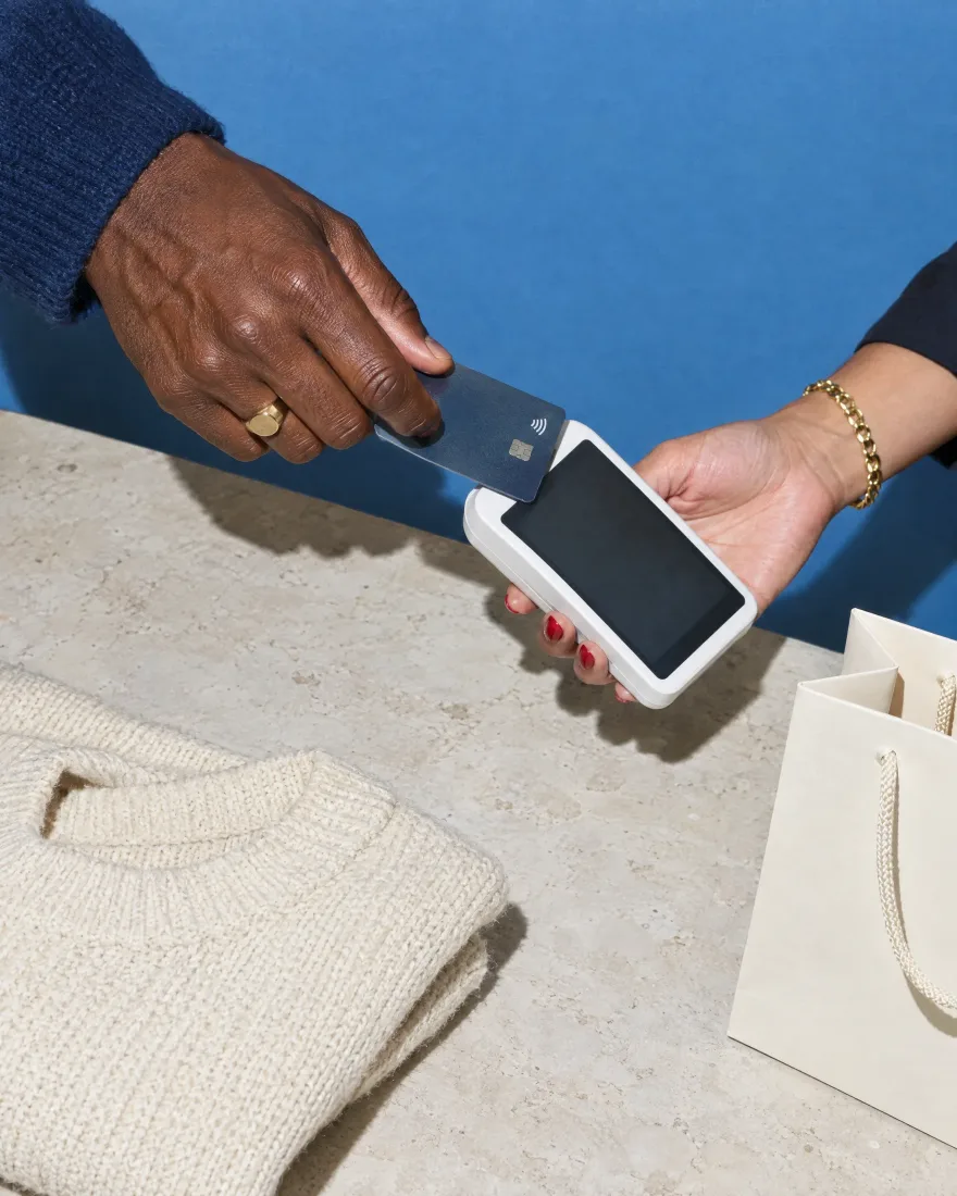 Paying by card at a shop counter
