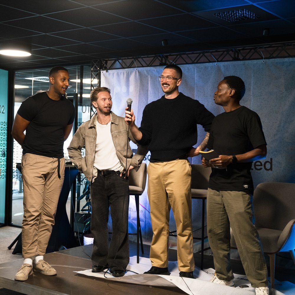 The Jenz founders standing on stage